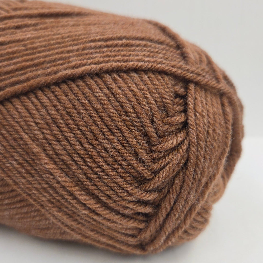 Brown skein of yarn on a white background